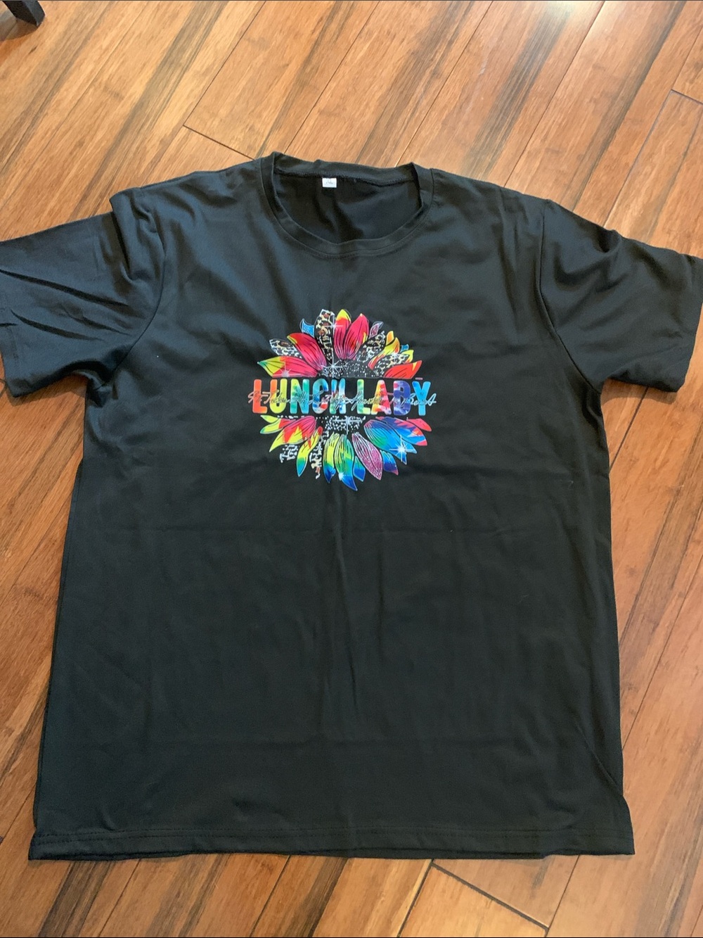 Black Graphic Tee with Colorful Floral Logo